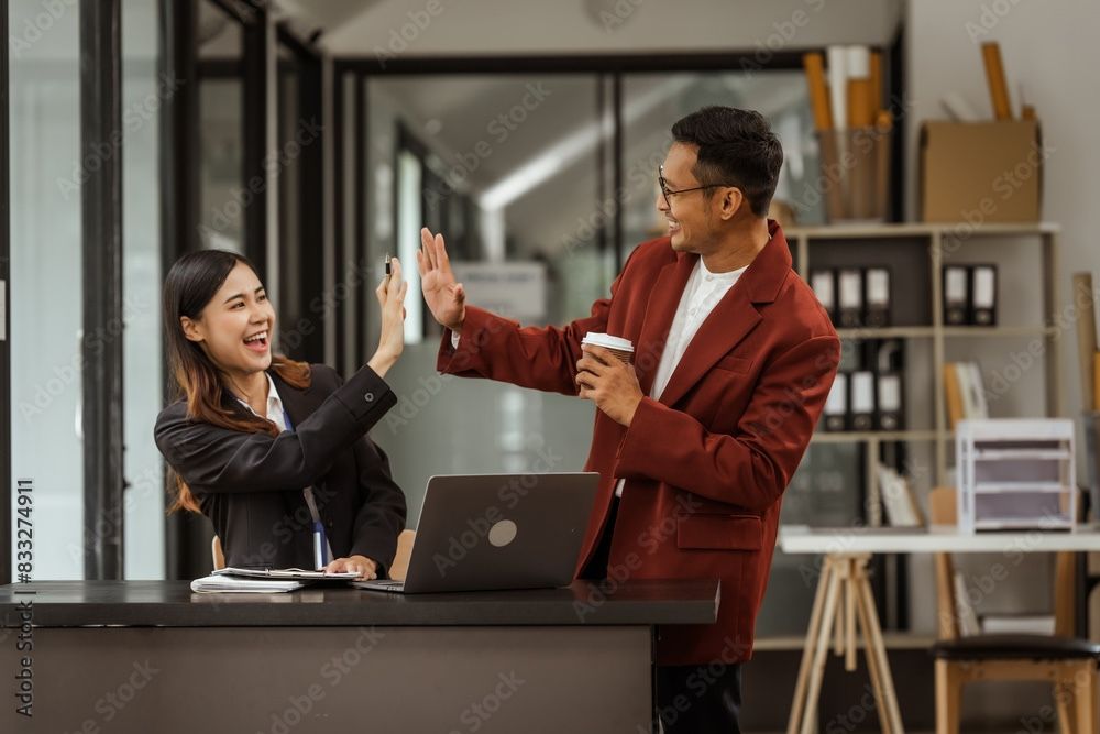 2 employees giving a high five