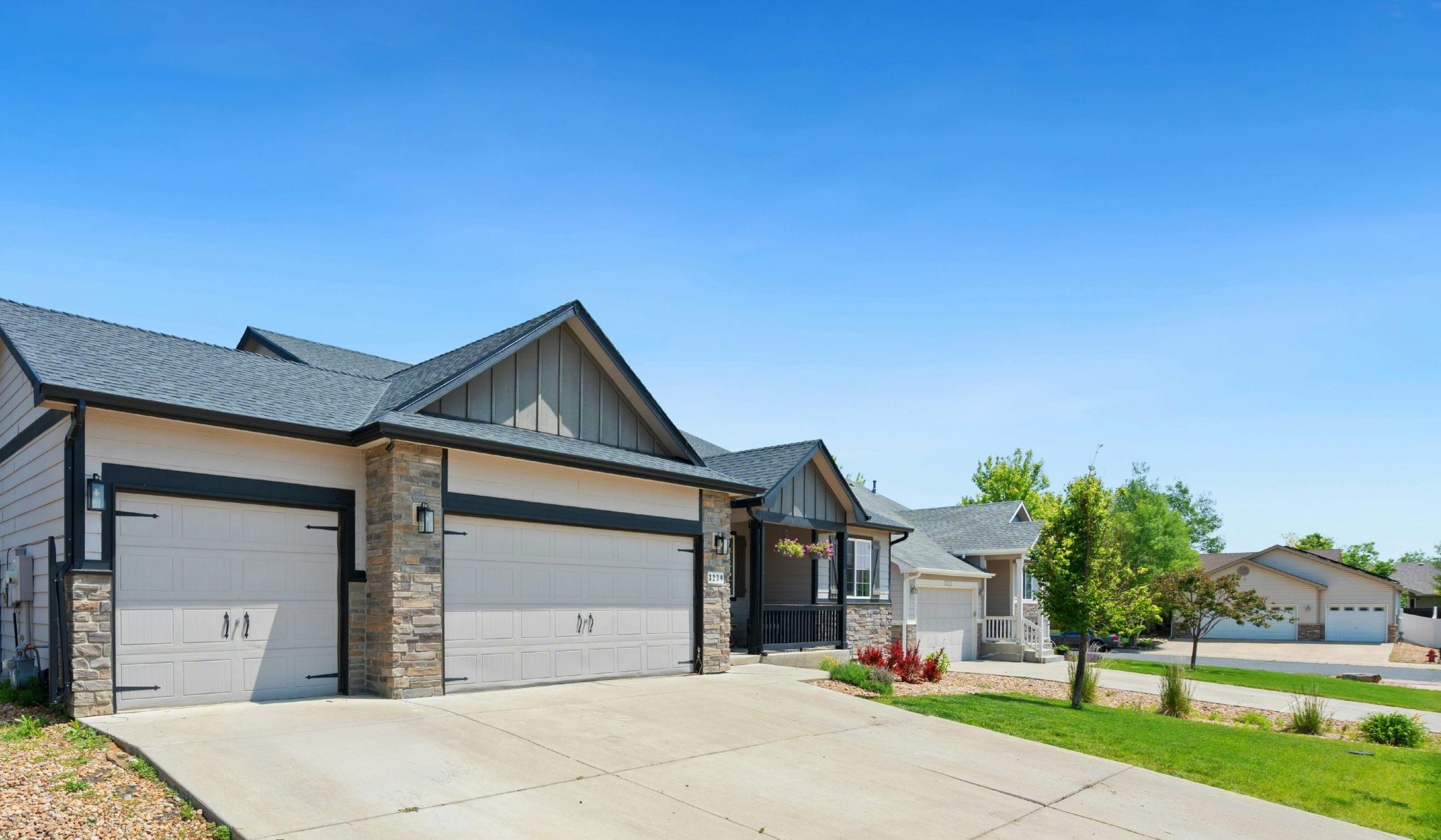 New construction home in a suburban neighborhood with modern exterior and driveway